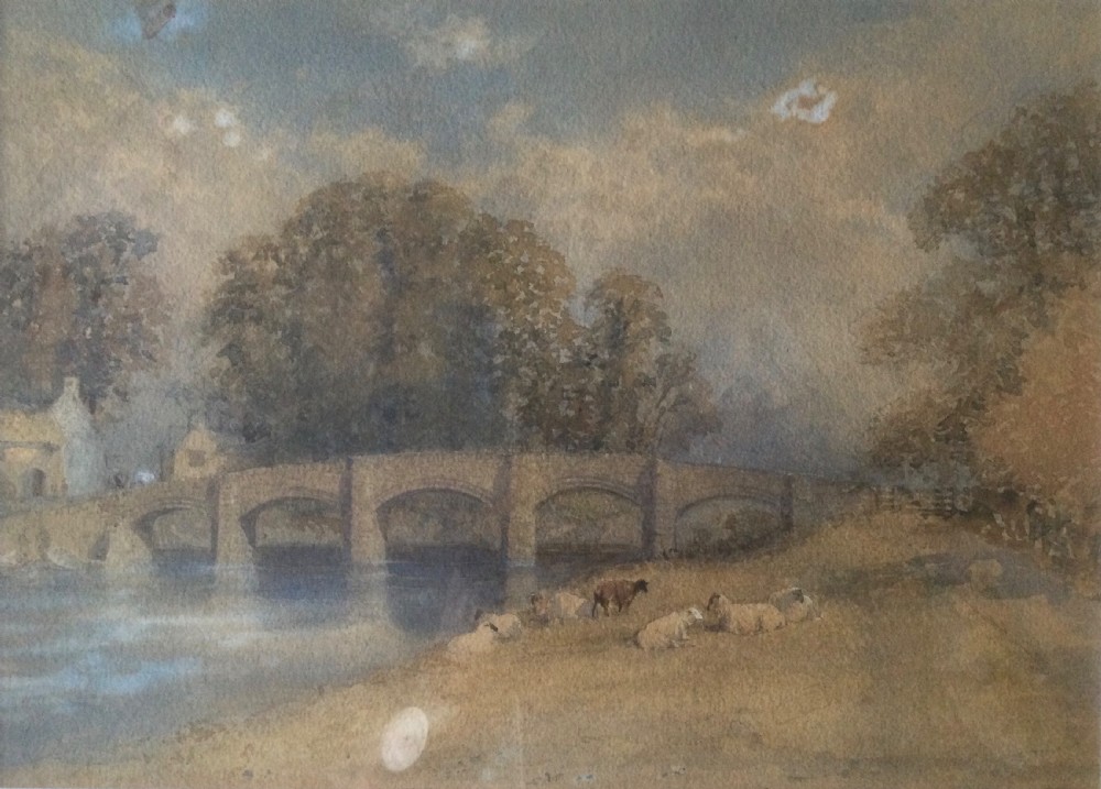 A pair of framed 19th-century watercolour paintings depicting English countryside scenes with stone buildings, bridges, and livestock set in gilt frames. View XII