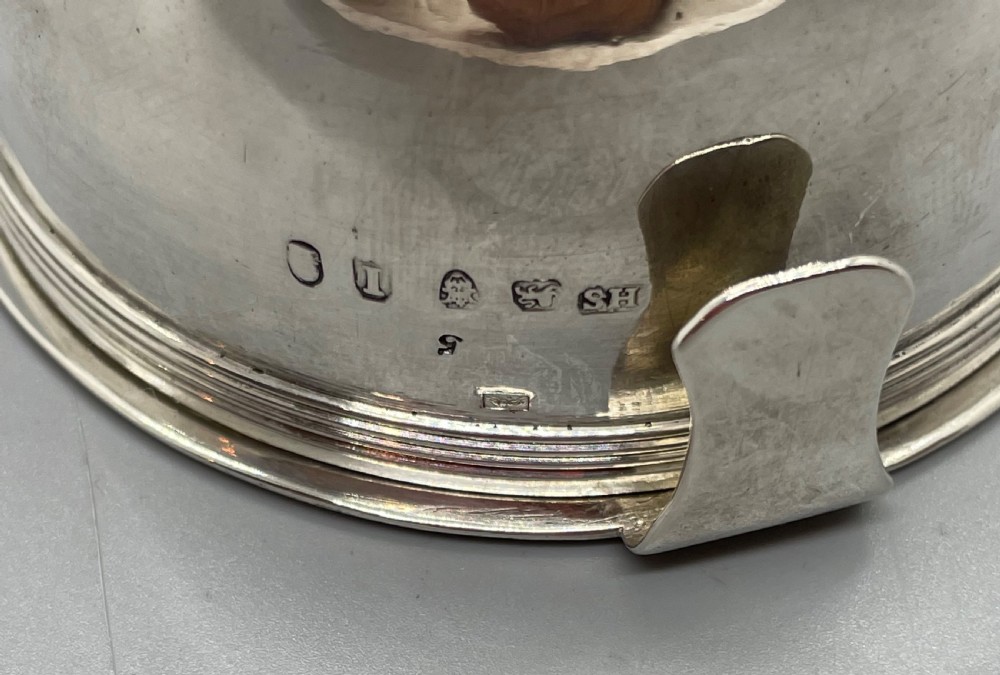 A sterling silver George III wine funnel featuring a reeded rim, side clip, curved spout, and London hallmarks. View IV