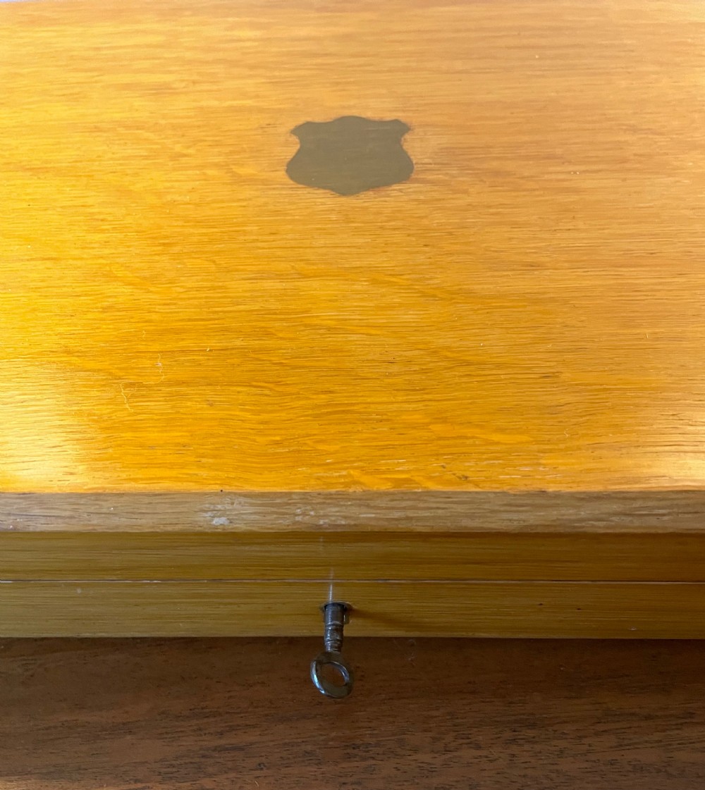 A Victorian silver-plated fruit cutlery set with mother-of-pearl handles displayed inside an open, blue velvet-lined wooden case. View VI