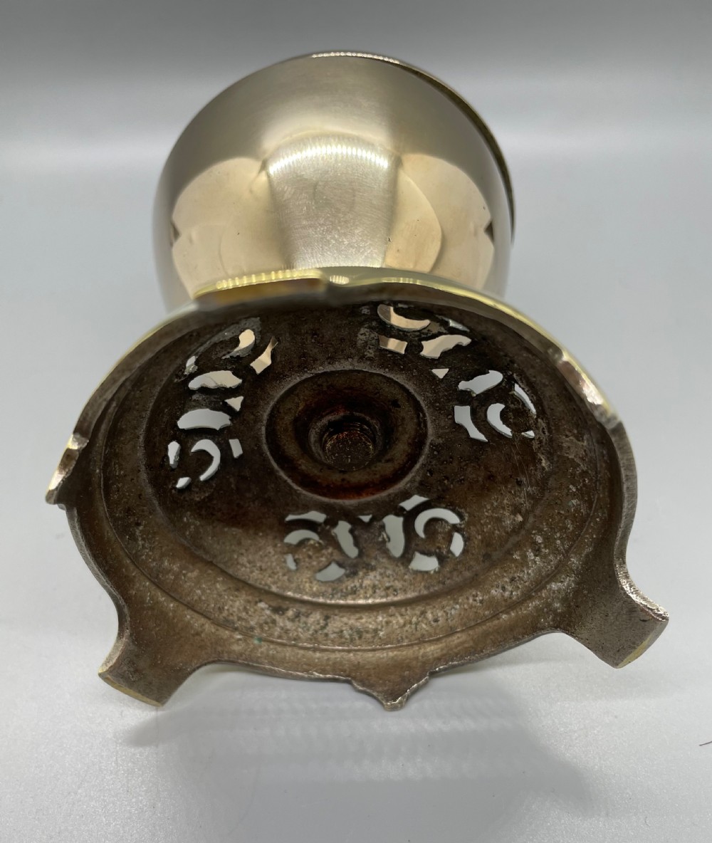 A late Victorian brass desk counter bell featuring an ornate pierced base, a dome top, and a decorative central push button. View III