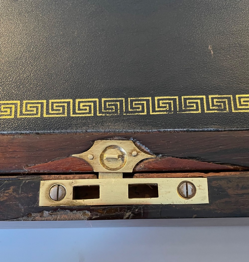 A dark brown rosewood rectangular writing slope decorated with floral mother of pearl inlay on the corners, lid centre, and lock escutcheon. View VII