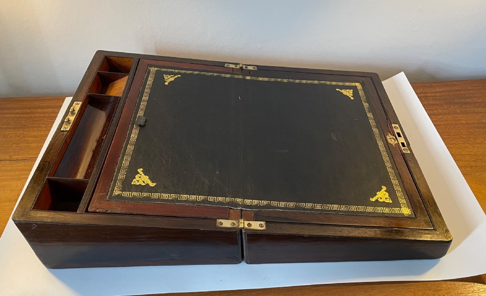 A dark brown rosewood rectangular writing slope decorated with floral mother of pearl inlay on the corners, lid centre, and lock escutcheon. View IX