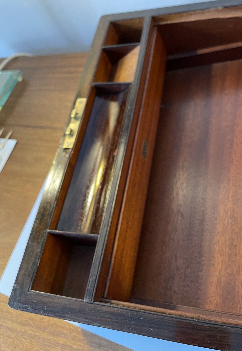 A dark brown rosewood rectangular writing slope decorated with floral mother of pearl inlay on the corners, lid centre, and lock escutcheon. View X