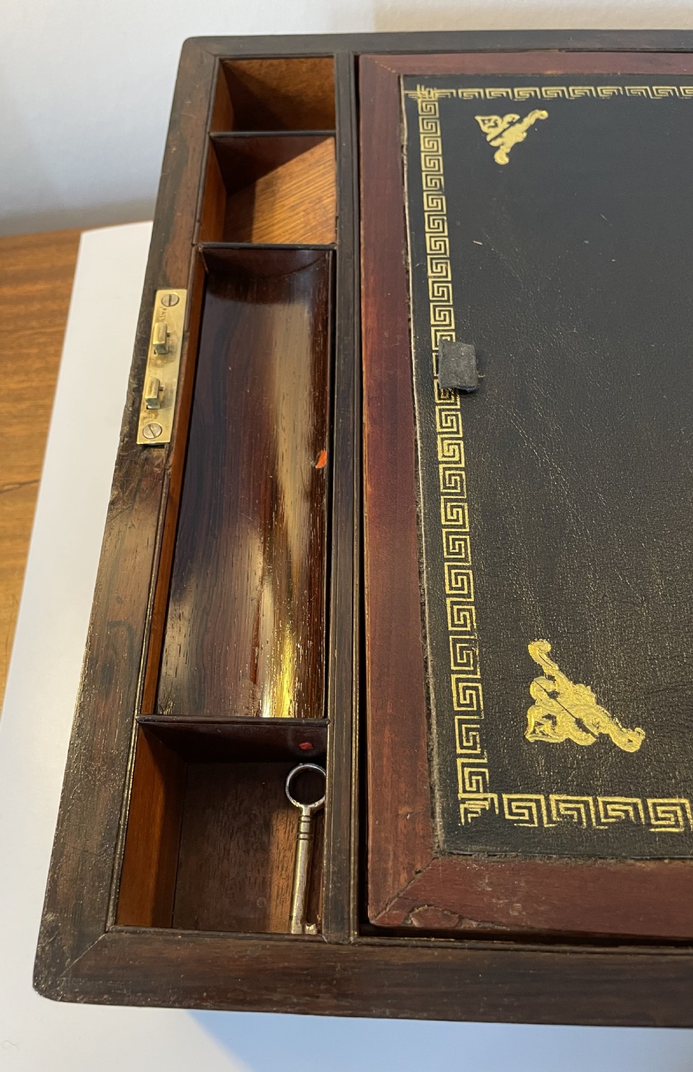 A dark brown rosewood rectangular writing slope decorated with floral mother of pearl inlay on the corners, lid centre, and lock escutcheon. View XI