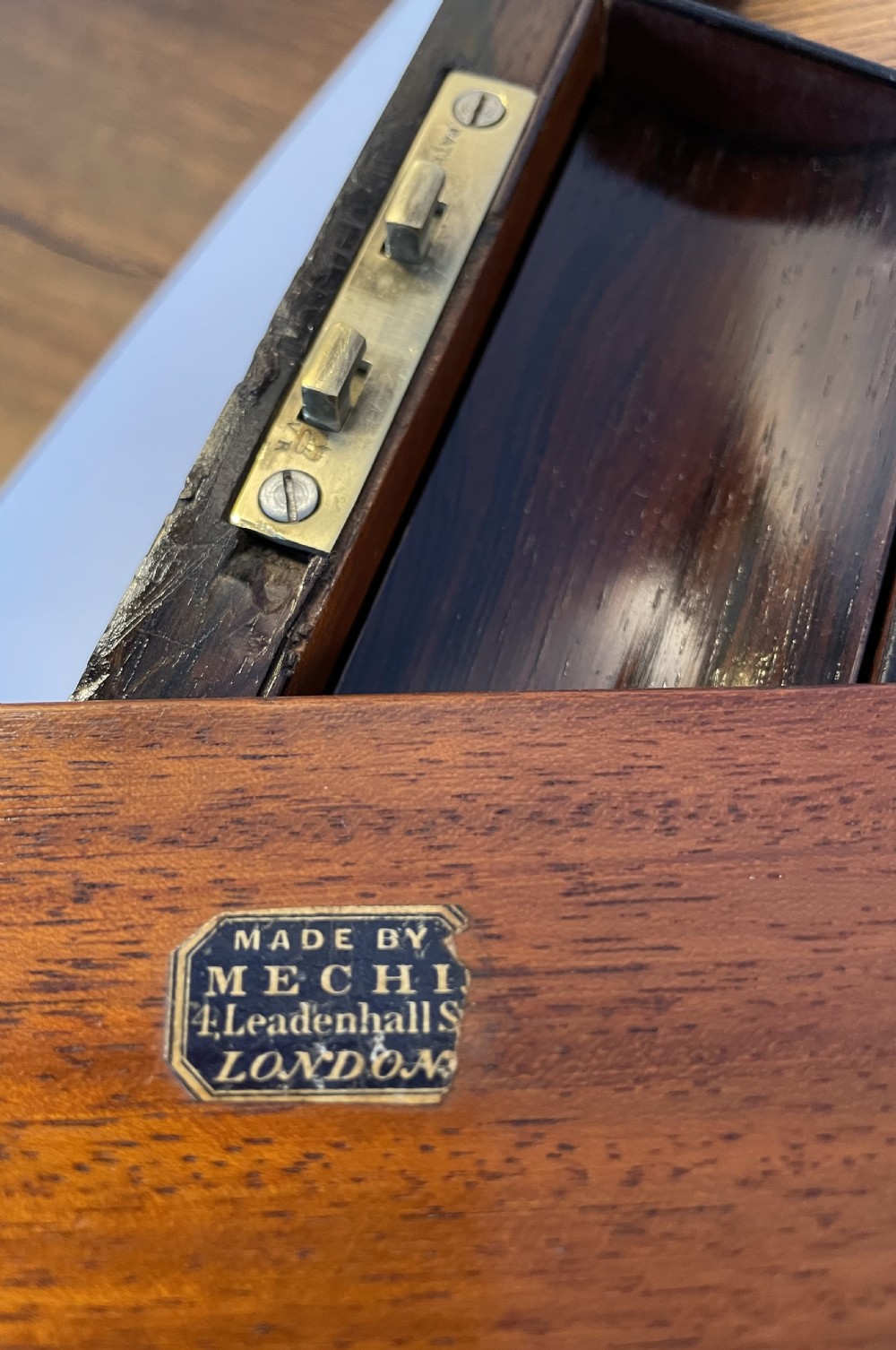 A dark brown rosewood rectangular writing slope decorated with floral mother of pearl inlay on the corners, lid centre, and lock escutcheon. View XII