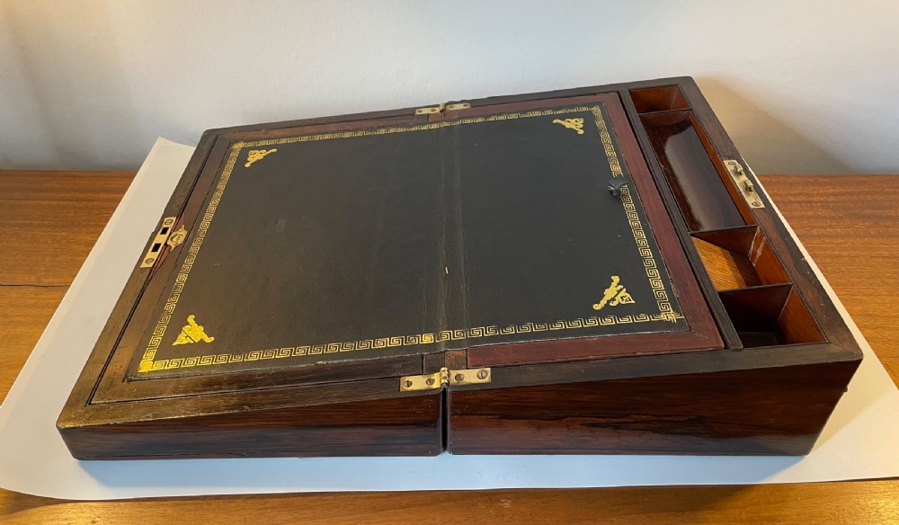A dark brown rosewood rectangular writing slope decorated with floral mother of pearl inlay on the corners, lid centre, and lock escutcheon. View XIII
