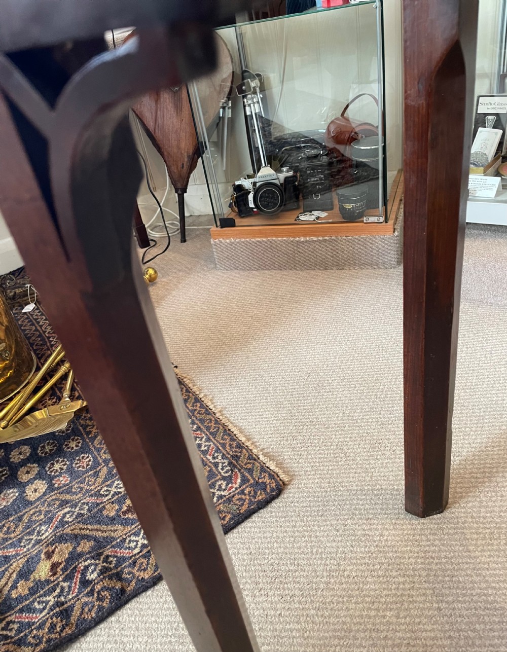 A Georgian mahogany fold-over tea table featuring straight square legs with subtle corner brackets and brass drop handles. View XIII
