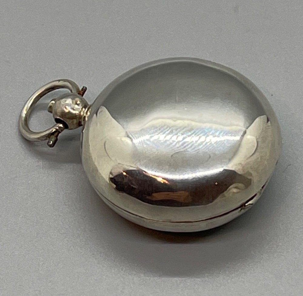 A circular Georgian sterling silver salver featuring a shaped gadrooned rim, an engraved central monogram, and three cast feet. View XIV