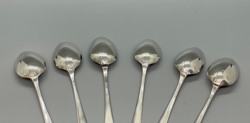 A set of six 18th-century George III sterling silver teaspoons with bright-cut lattice engraving along the handles. View IV