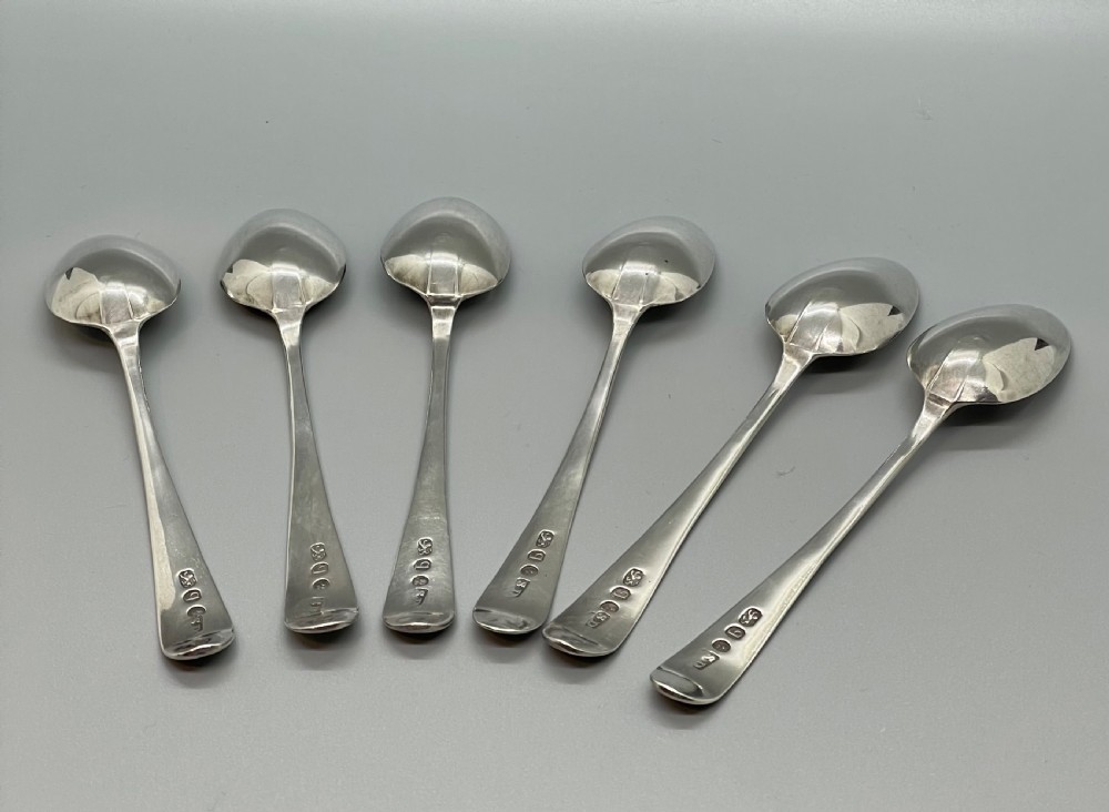 A set of six 18th-century George III sterling silver teaspoons with bright-cut lattice engraving along the handles. View V