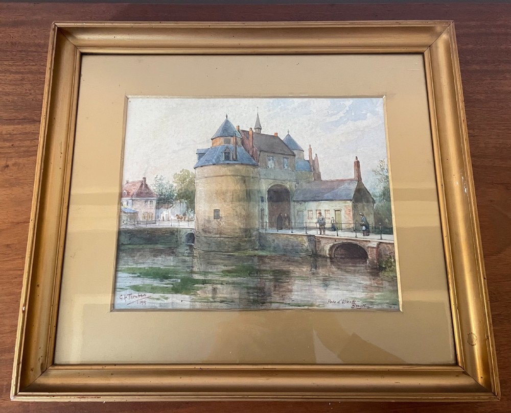 A framed Edwardian watercolour painting depicting the historic Porte dOstende gate and bridge in Bruges rendered in muted tones.