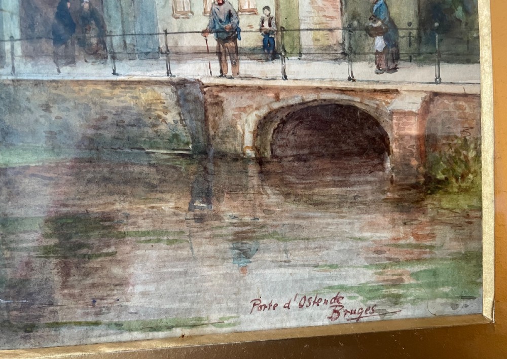 A framed Edwardian watercolour painting depicting the historic Porte dOstende gate and bridge in Bruges rendered in muted tones. View VI