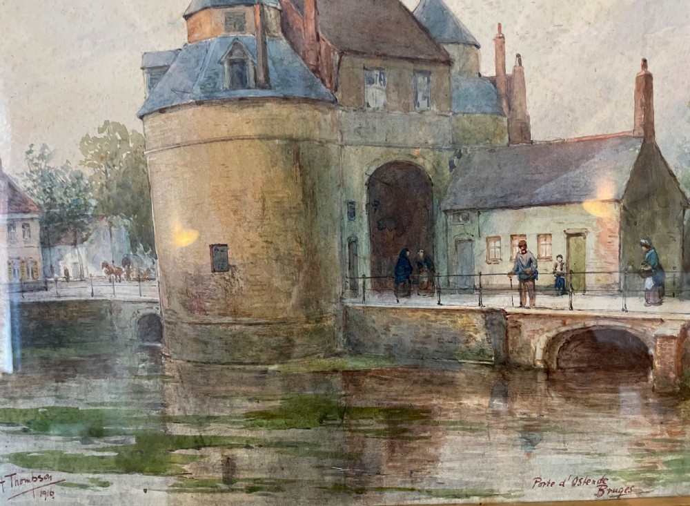 A framed Edwardian watercolour painting depicting the historic Porte dOstende gate and bridge in Bruges rendered in muted tones. View IX