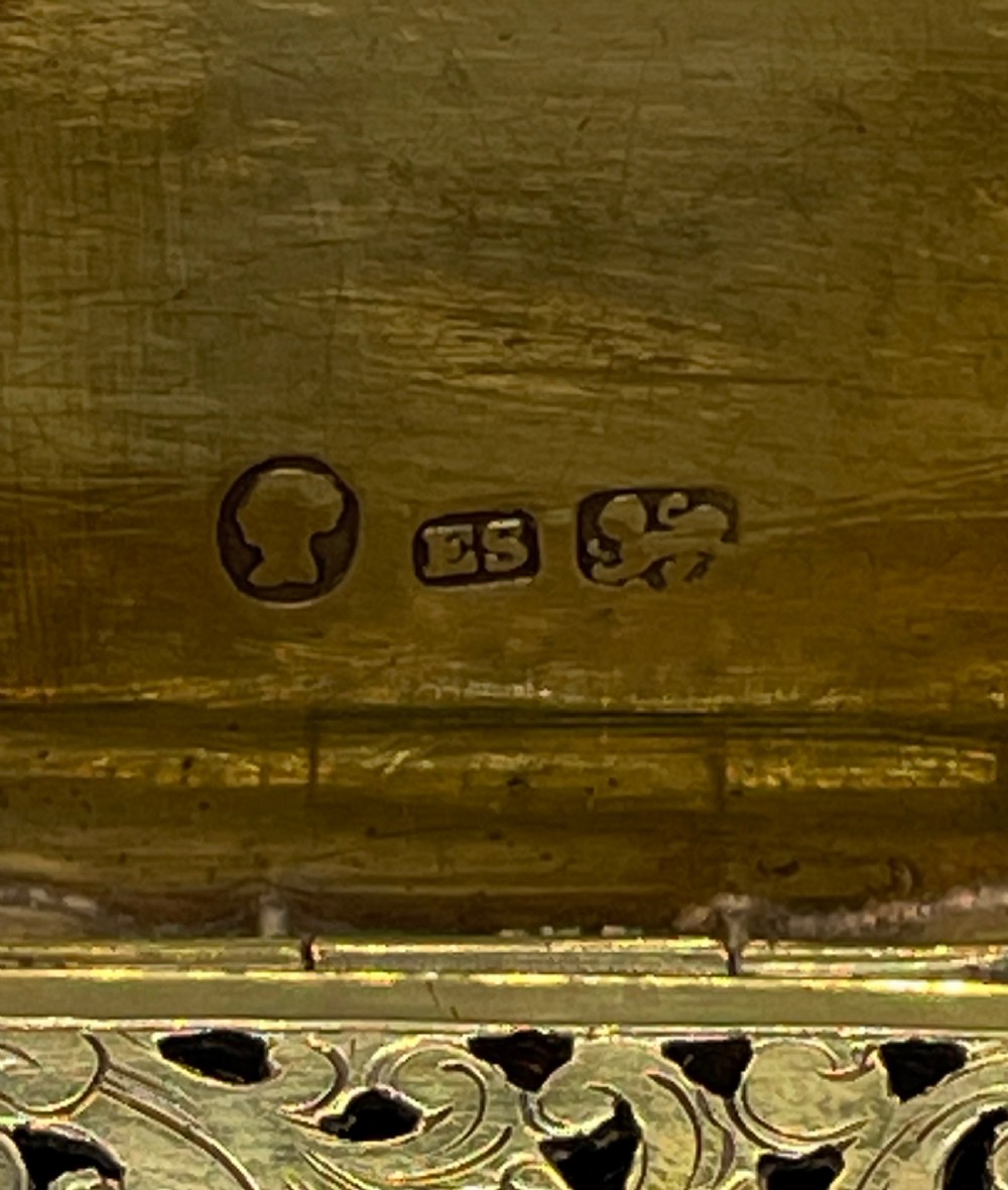 An early Victorian rectangular sterling silver vinaigrette box with scrollwork engraving, shaped edges, and a central monogrammed cartouche. View VII