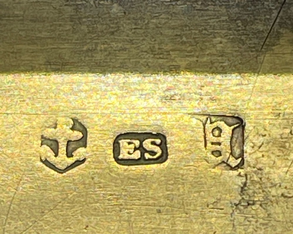 An early Victorian rectangular sterling silver vinaigrette box with scrollwork engraving, shaped edges, and a central monogrammed cartouche. View VIII