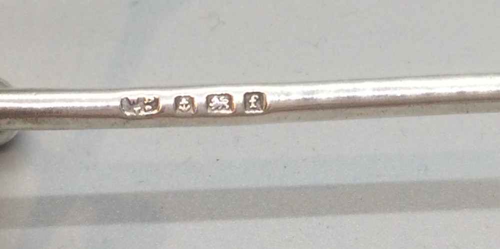 A pair of Edwardian sterling silver knife rests featuring ball-ended cross terminals joined by horizontal bars. View V