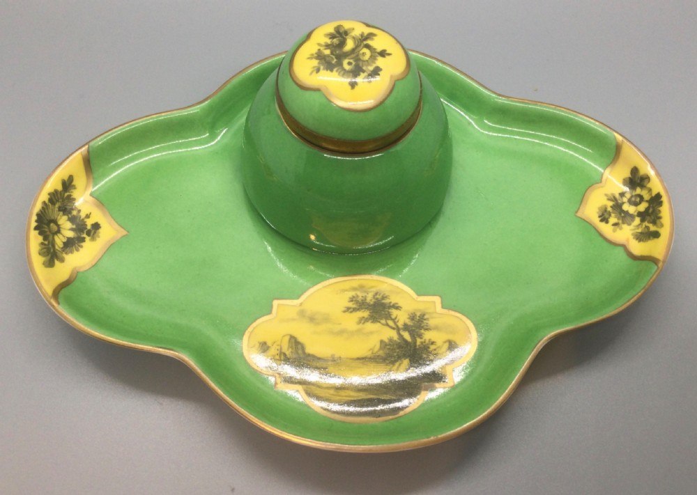 An early 19th-century green and yellow porcelain inkstand featuring a central dome inkwell and hand-painted landscape reserves on a shaped tray. View II