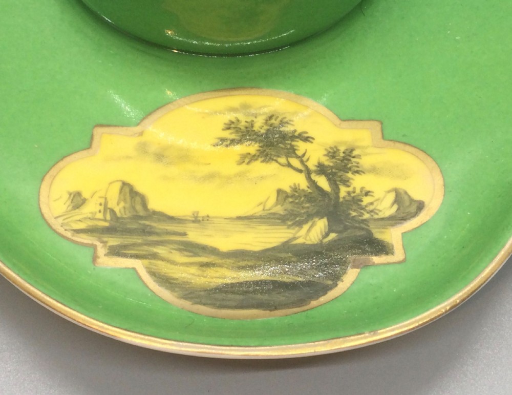 An early 19th-century green and yellow porcelain inkstand featuring a central dome inkwell and hand-painted landscape reserves on a shaped tray. View III