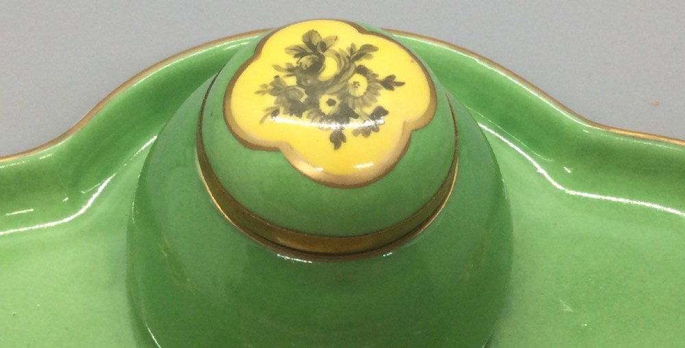 An early 19th-century green and yellow porcelain inkstand featuring a central dome inkwell and hand-painted landscape reserves on a shaped tray. View IV