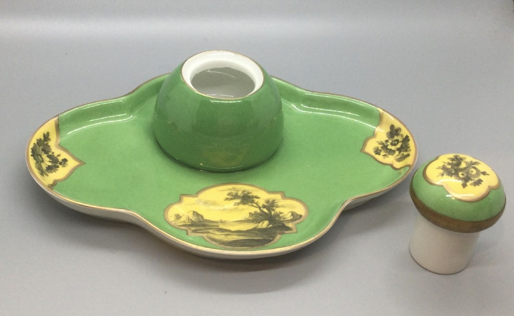 An early 19th-century green and yellow porcelain inkstand featuring a central dome inkwell and hand-painted landscape reserves on a shaped tray. View IX