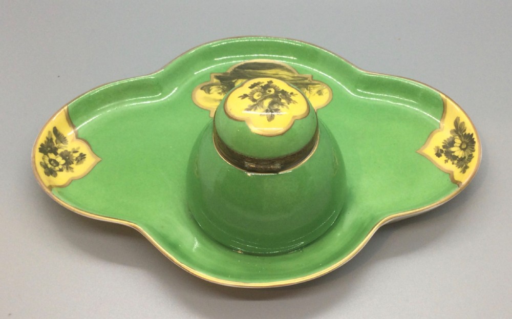An early 19th-century green and yellow porcelain inkstand featuring a central dome inkwell and hand-painted landscape reserves on a shaped tray. View XII
