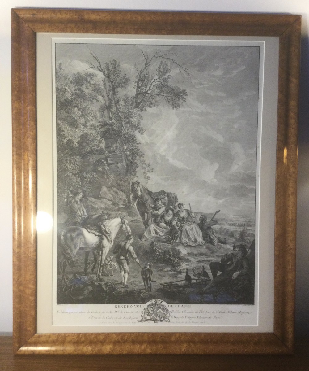 An 18th-century French monochrome engraving depicting figures and horses in a rural landscape, housed within a burr wood frame.