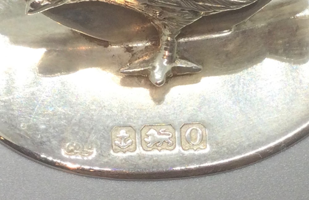 A pair of Edwardian sterling silver circular menu holders featuring sculpted game birds mounted on oval silver bases. View VIII