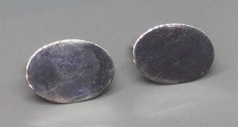 A pair of Edwardian sterling silver circular menu holders featuring sculpted game birds mounted on oval silver bases. View IX