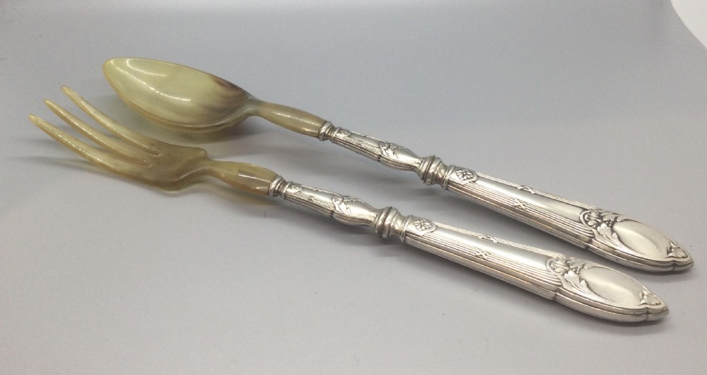 A late nineteenth-century French silver and horn salad serving set presented inside an open green fitted box with yellow lining. View II