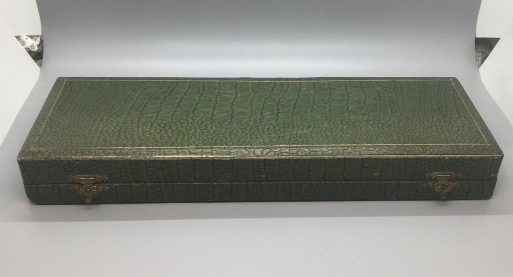 A late nineteenth-century French silver and horn salad serving set presented inside an open green fitted box with yellow lining. View VIII