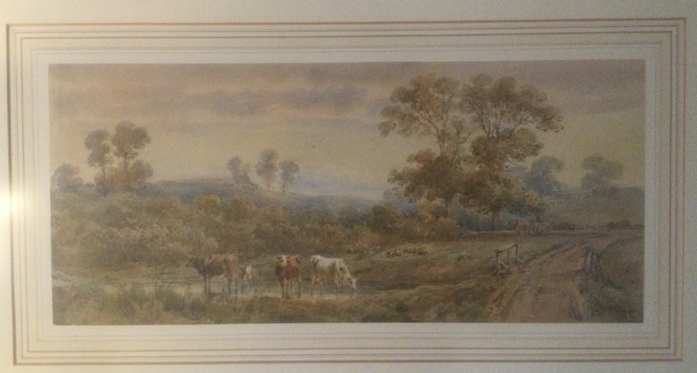 A mid-19th-century watercolour painting depicting a pastoral landscape with cows drinking near a dirt track, housed in a gilt frame. View IV