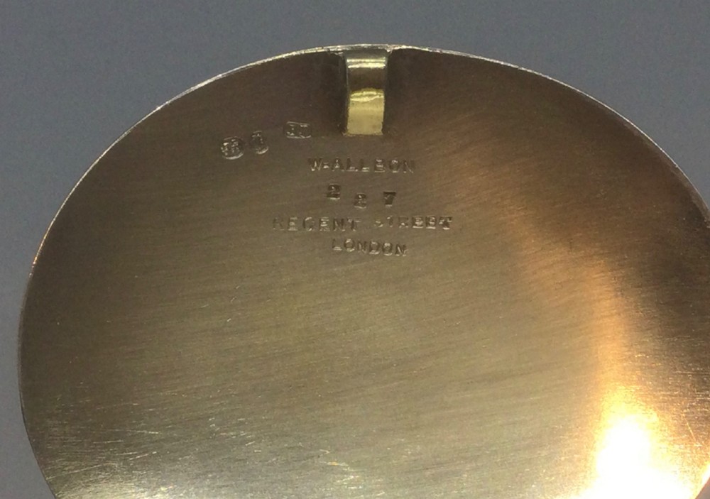 An oval Victorian sterling silver snuff box with engine-turned geometric engraving and a central vacant cartouche on top. View VIII