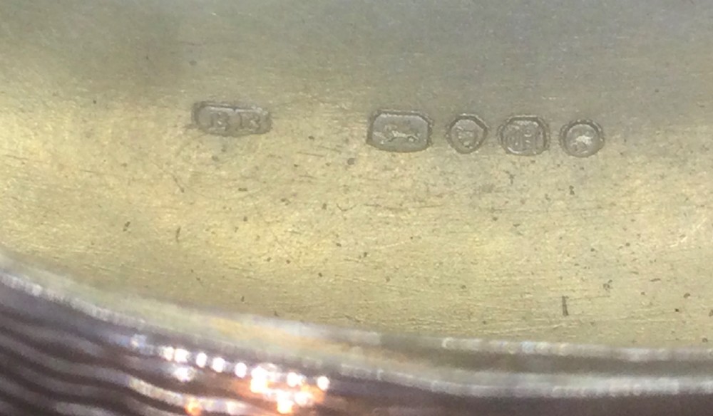 An oval Victorian sterling silver snuff box with engine-turned geometric engraving and a central vacant cartouche on top. View IX