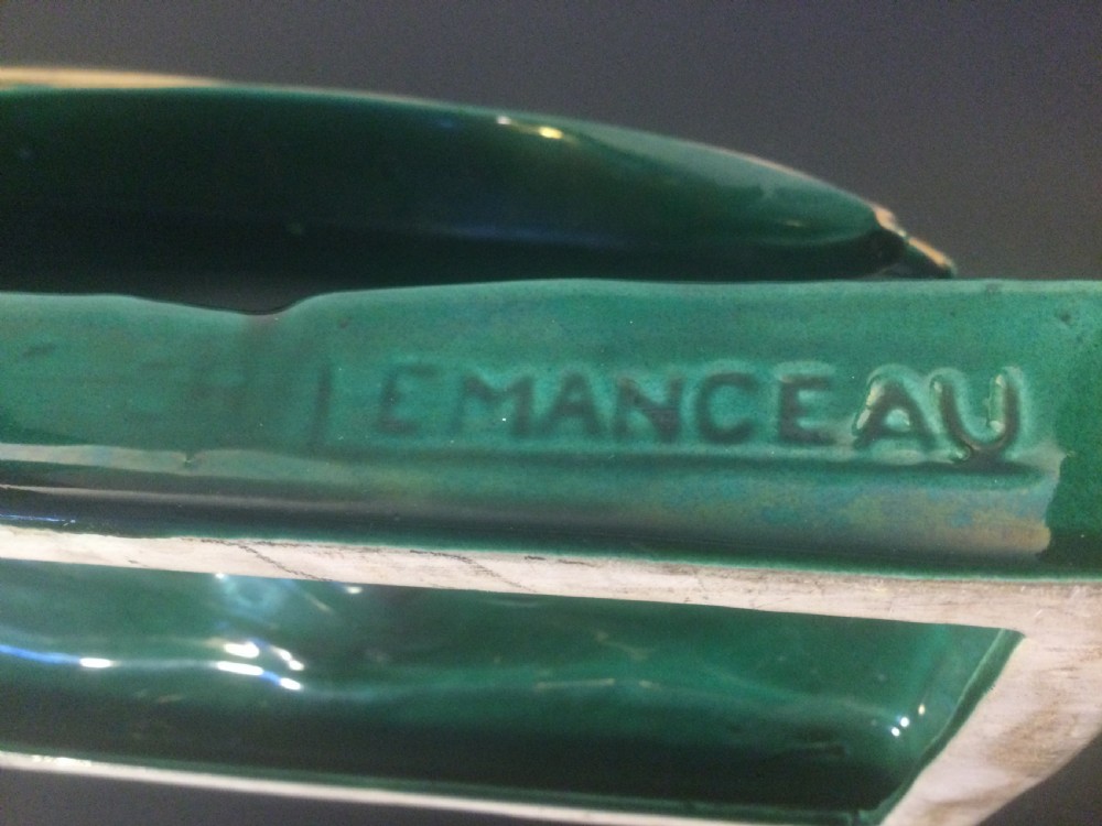 A stylised Art Deco green glazed ceramic pheasant figurine featuring fine gold line details and an extended sweeping tail resting on an integrated base. View VIII