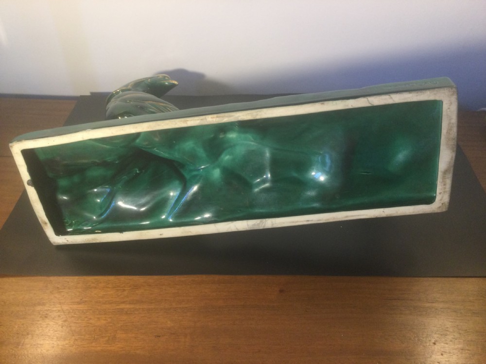 A stylised Art Deco green glazed ceramic pheasant figurine featuring fine gold line details and an extended sweeping tail resting on an integrated base. View IX