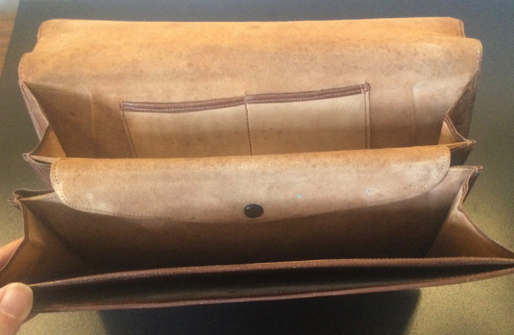 A 1930s rectangular python skin clutch bag featuring natural cream and brown mottled scales and a metal top clasp. View VI