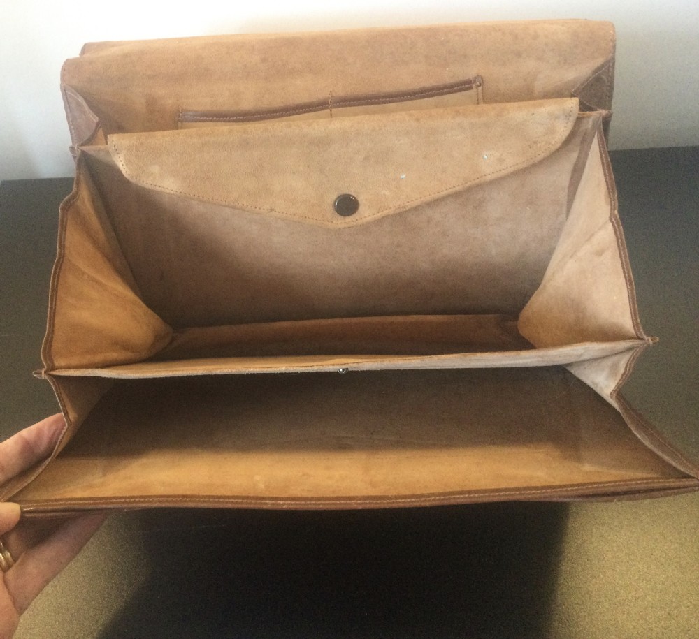 A 1930s rectangular python skin clutch bag featuring natural cream and brown mottled scales and a metal top clasp. View X