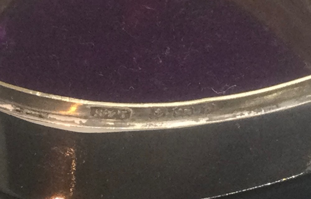 A small polished heart-shaped sterling silver trinket box with a hinged domed lid and visible hallmarks. View V