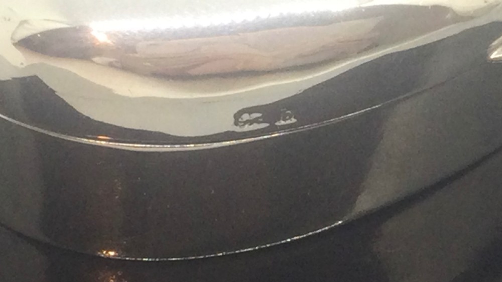 A small polished heart-shaped sterling silver trinket box with a hinged domed lid and visible hallmarks. View VIII