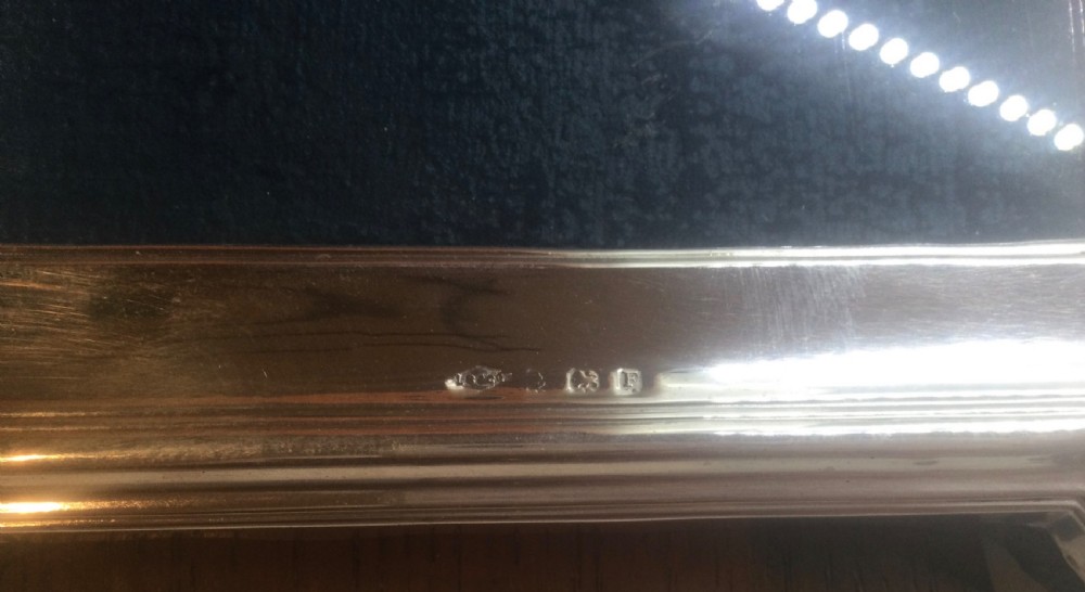 An Art Deco sterling silver picture frame featuring a stepped gabled top moulding and an easel back support. View VI