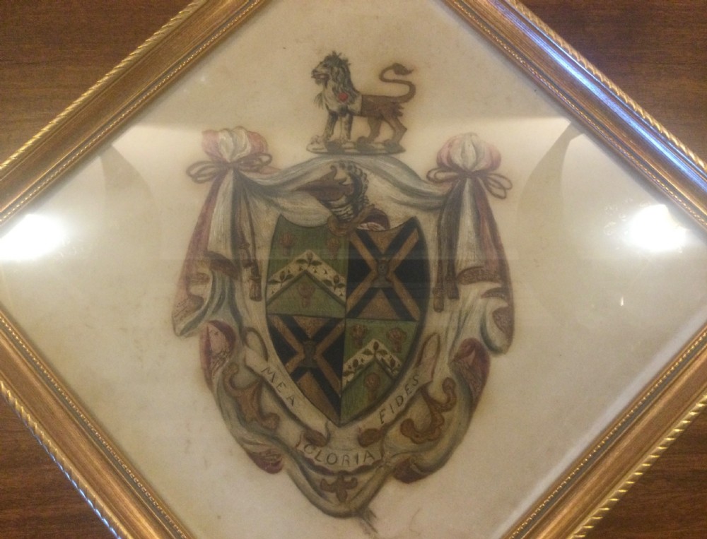 A diamond-shaped gilded frame housing a 19th-century oil painting on glass of an armorial crest with a lion, shield, and Latin motto banner. View II
