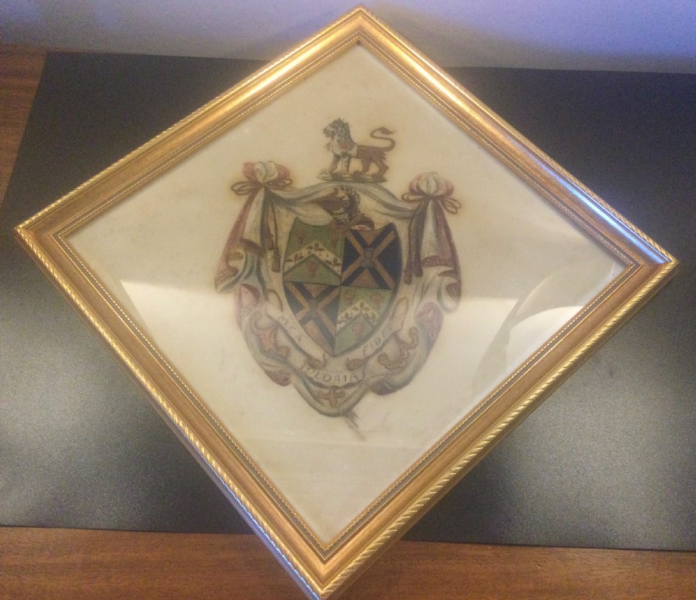 A diamond-shaped gilded frame housing a 19th-century oil painting on glass of an armorial crest with a lion, shield, and Latin motto banner. View III