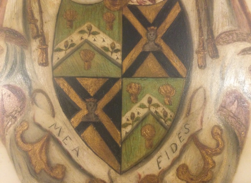 A diamond-shaped gilded frame housing a 19th-century oil painting on glass of an armorial crest with a lion, shield, and Latin motto banner. View X