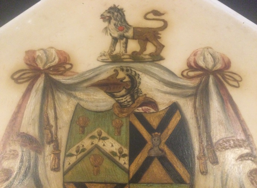 A diamond-shaped gilded frame housing a 19th-century oil painting on glass of an armorial crest with a lion, shield, and Latin motto banner. View XI