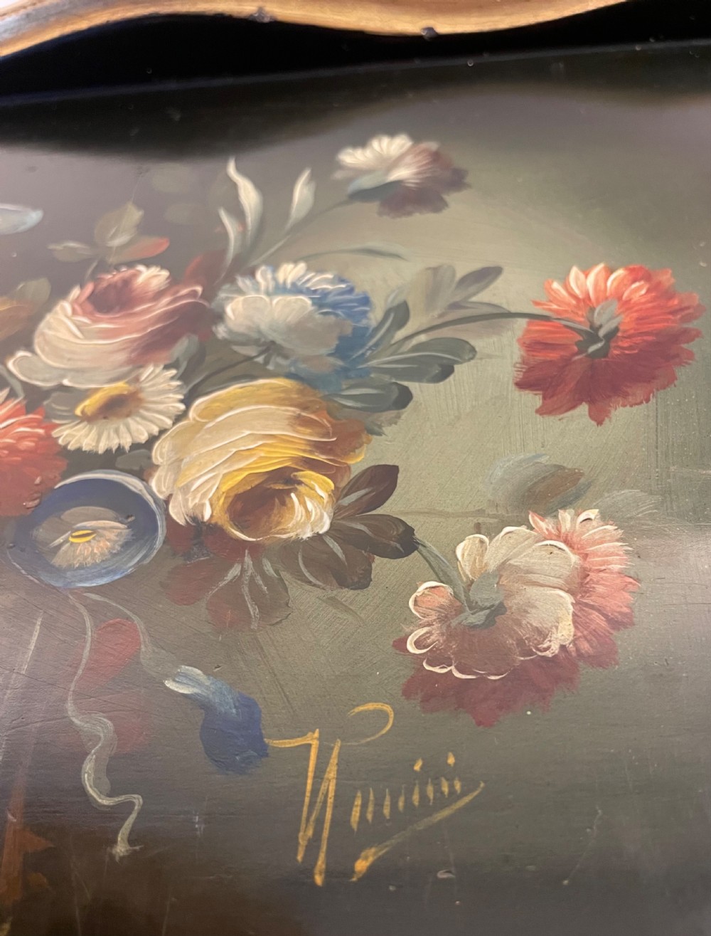 A black lacquered wooden desktop paper sorter featuring five tiered shelf slots, hand-painted floral decoration on top, and a carved gilt moulding frame. View IV