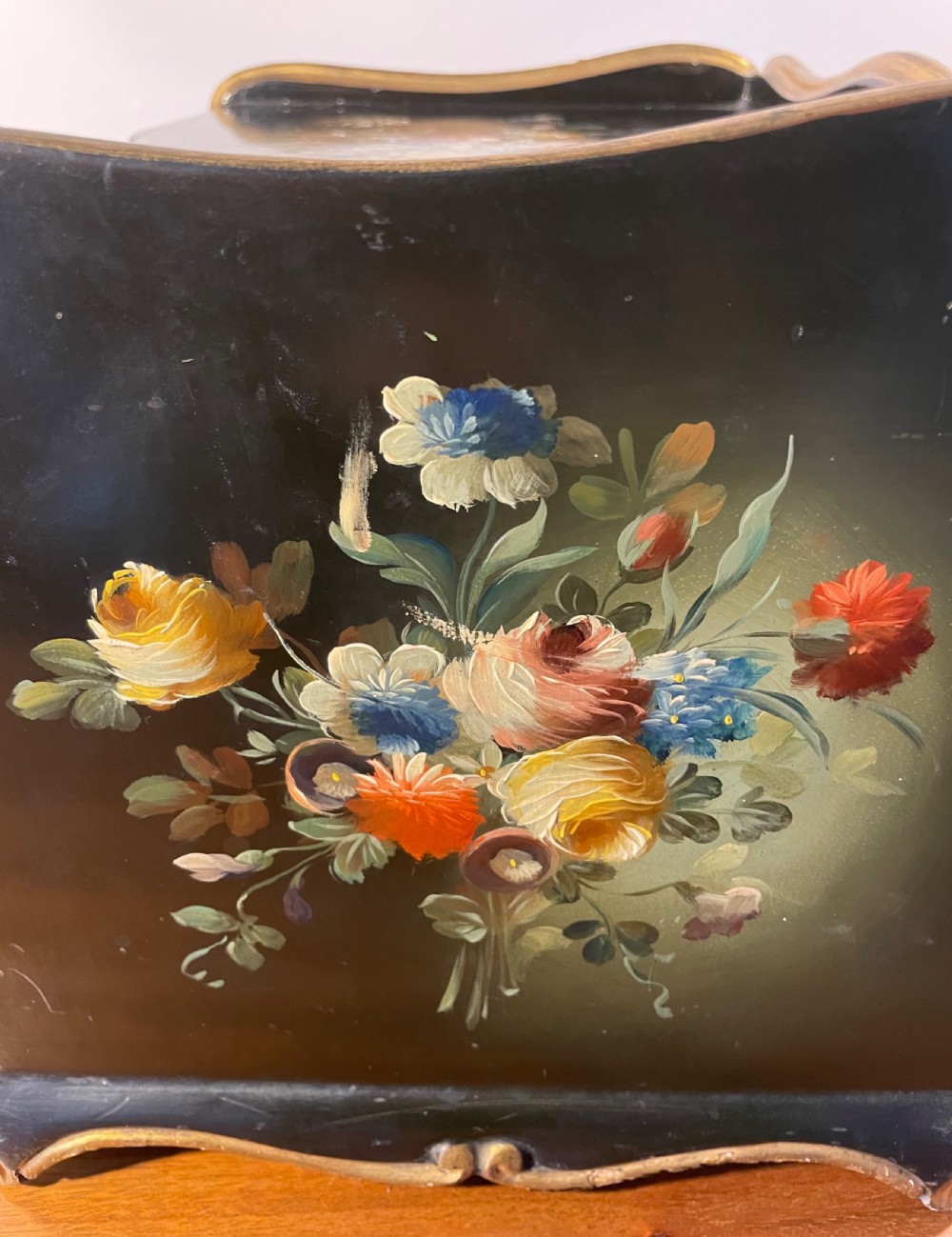 A black lacquered wooden desktop paper sorter featuring five tiered shelf slots, hand-painted floral decoration on top, and a carved gilt moulding frame. View VIII