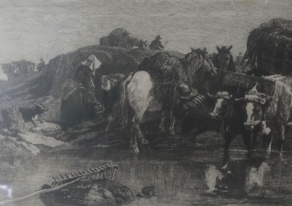 A framed nineteenth-century monochrome etching depicting figures and horse-drawn carts gathering seaweed on the Guernsey coastline. View X