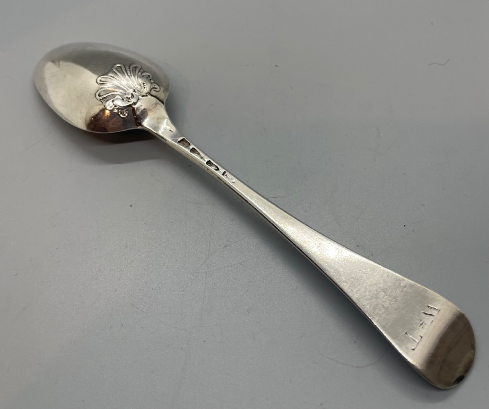 A George II sterling silver tablespoon featuring a classic Hanoverian pattern with an upturned stem and polished oval bowl. View III