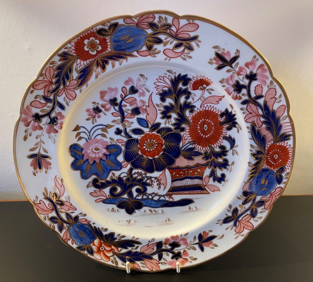 Three 19th-century Staffordshire plates featuring Imari floral designs in cobalt blue, iron red, pink, and gilt. View II