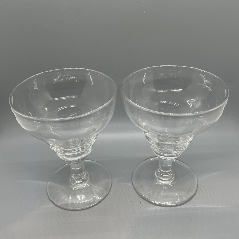 A matched pair of clear Georgian glass rummers featuring ogee-shaped bowls, short stems, and circular flat feet. View II